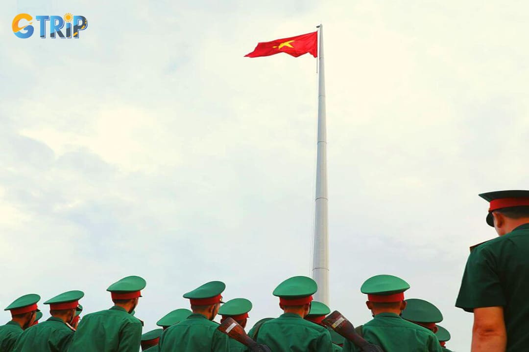 The flagpole stands atop a hill, offering a panoramic view of the surrounding Van Hai Archipelago