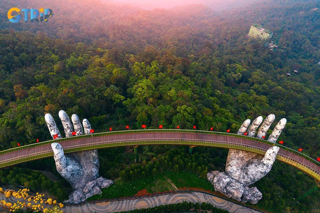 The Golden Bridge is Ba Na Hills’ iconic highlight, where a 150-meter skywalk held by giant stone hands offers surreal, cloud-level views of the Truong Son Mountains