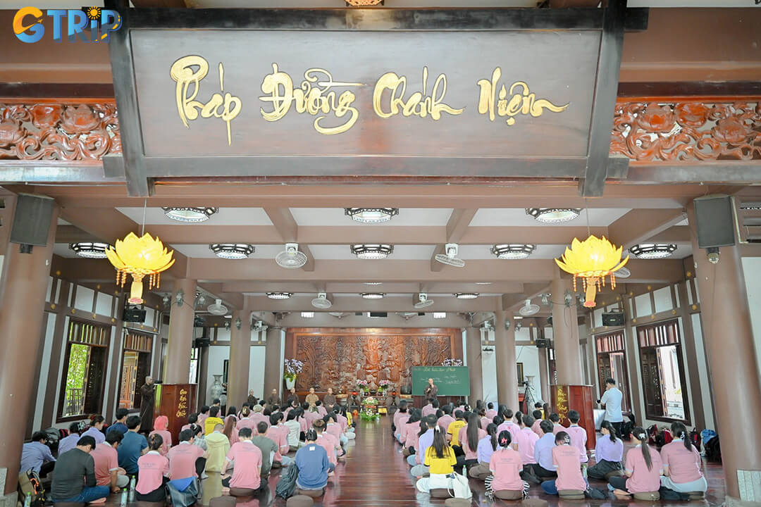 The “Hall of Awakening” is the monastery’s central wooden ceremonial hall, marked by lotus-carved steps, layered tiled roofs, and softly glowing lanterns