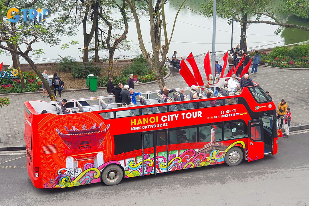 The Hanoi hop-on hop-off bus tour is an open-top double-decker sightseeing service that offers visitors a flexible way to explore Vietnam's capital city at their own pace