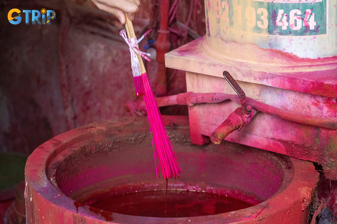 The heart of Quang Phu Cau's allure lies in its traditional incense-making process, which tourists can both observe and join