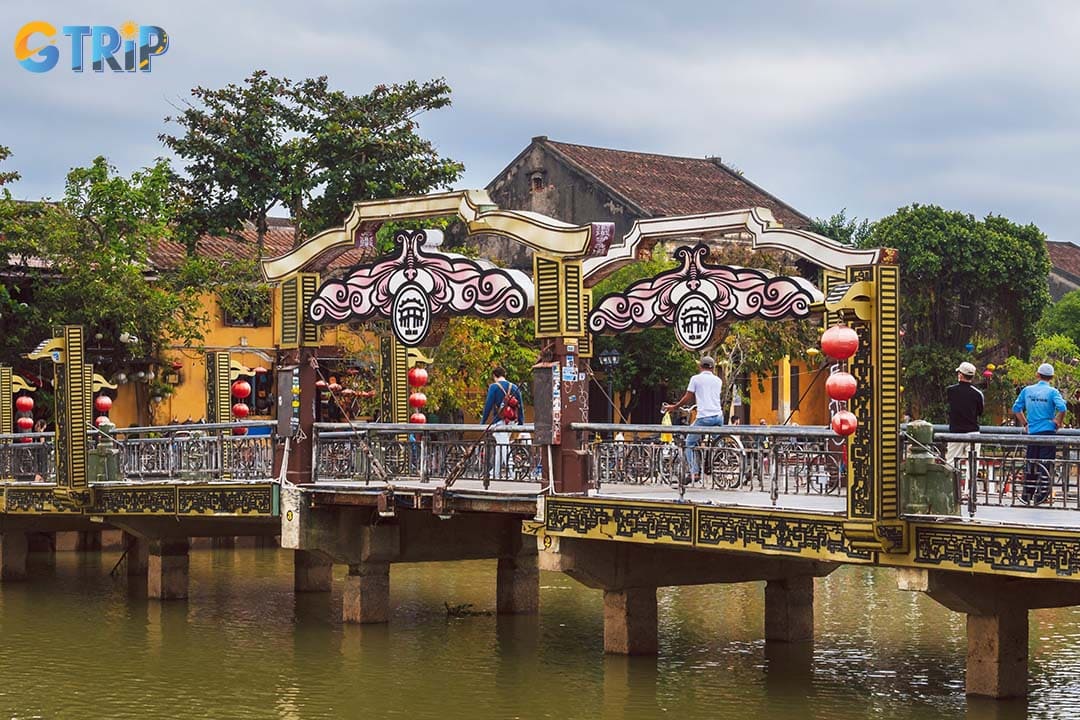 The Hoi An City logos are in the center of the bridge, so you can take photos of them and you
