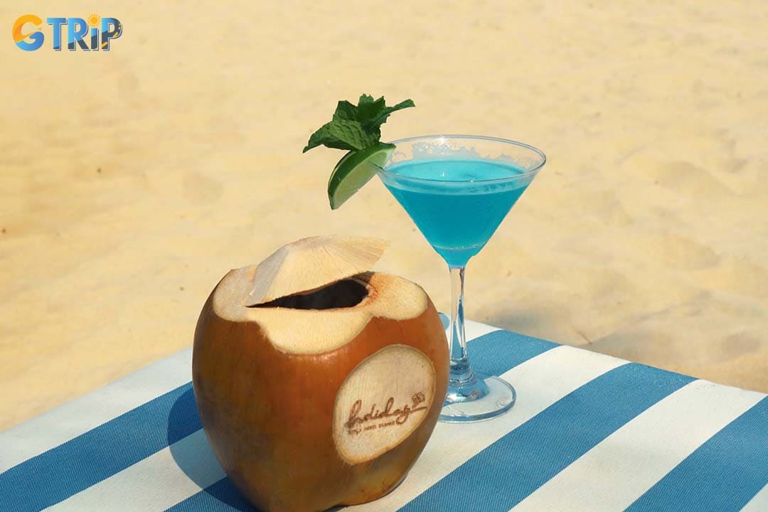 The Holiday Beach Club is a premium beachfront club at The Holiday Beach Danang Hotel & Resort with a large pool, luxury daybeds, and attentive resort service