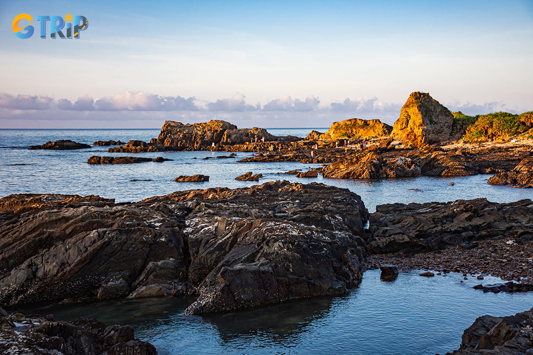 The iconic Dragon Claw Rock formation is a must-visit when you're at Dragon Claw Beach