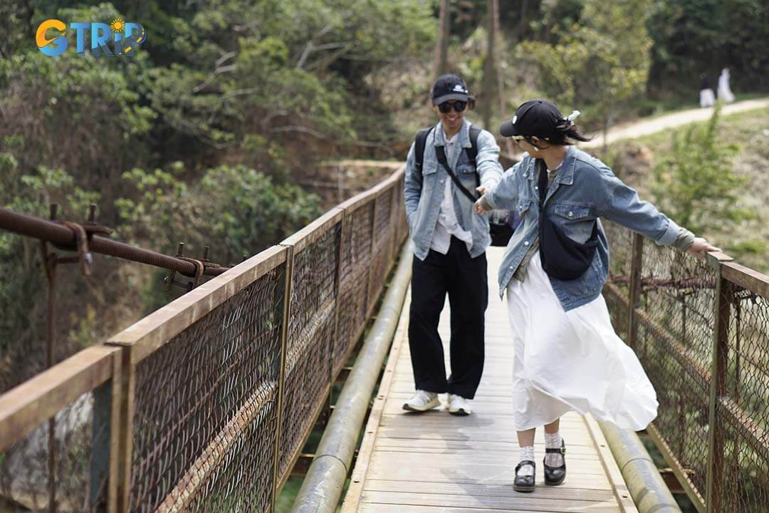 The Kon Tu Rang Suspension Bridge, built in 1994, spans the Dak Bla River with striking views and serves as both a vital link and a cultural symbol