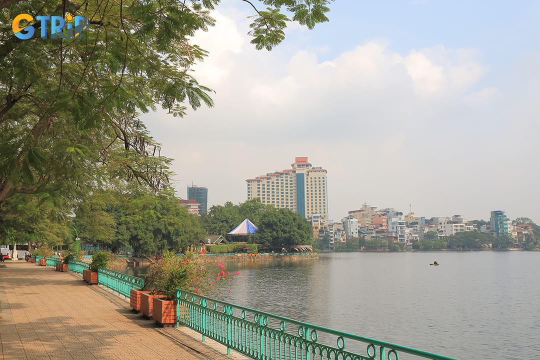 The landscaping surrounding Truc Bach Lake creates a tranquil urban green space where graceful bamboo and willow trees line the lakeside pathways