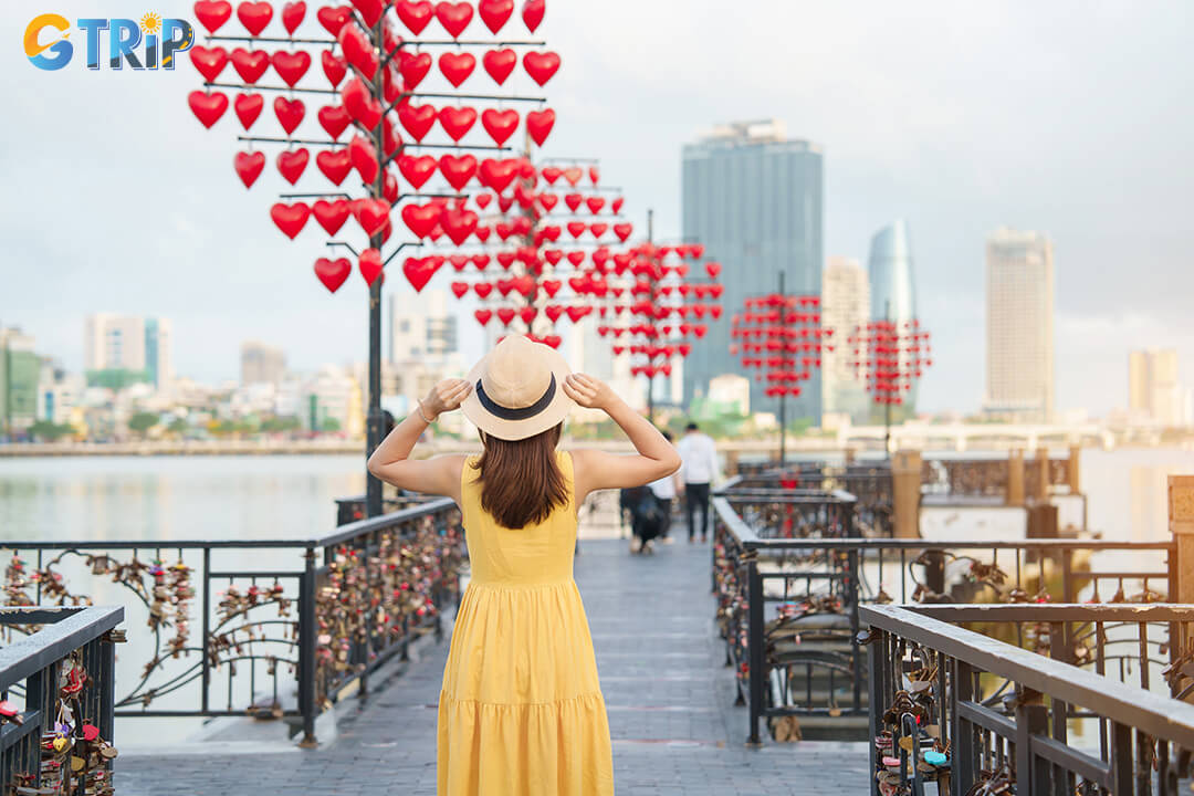 The Love Lock Bridge is a romantic riverside spot in Da Nang where couples attach padlocks as symbols of love while enjoying beautiful night views near Dragon Bridge