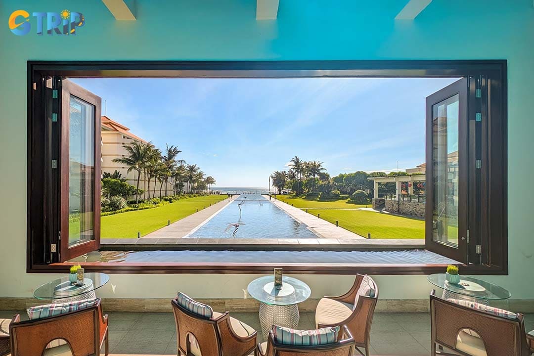 The luxury Infinity Bar offers a beautiful view of a stunning infinity pool that seems to merge with the turquoise sea