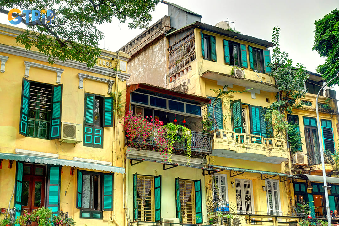 The most recognizable characteristic of the French Quarter is its signature yellow-painted buildings with their distinctive red tile roofs and green shutters