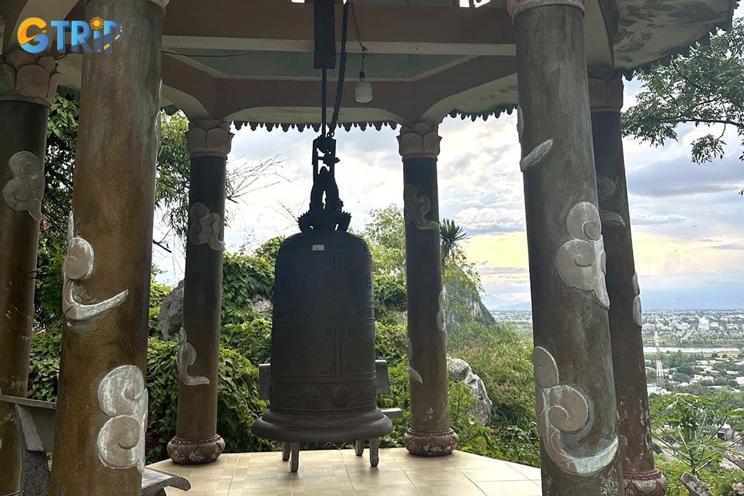 The pagoda preserves invaluable royal relics, including a large bronze bell cast in 1825 under King Minh Mang and a stone plaque from the same era