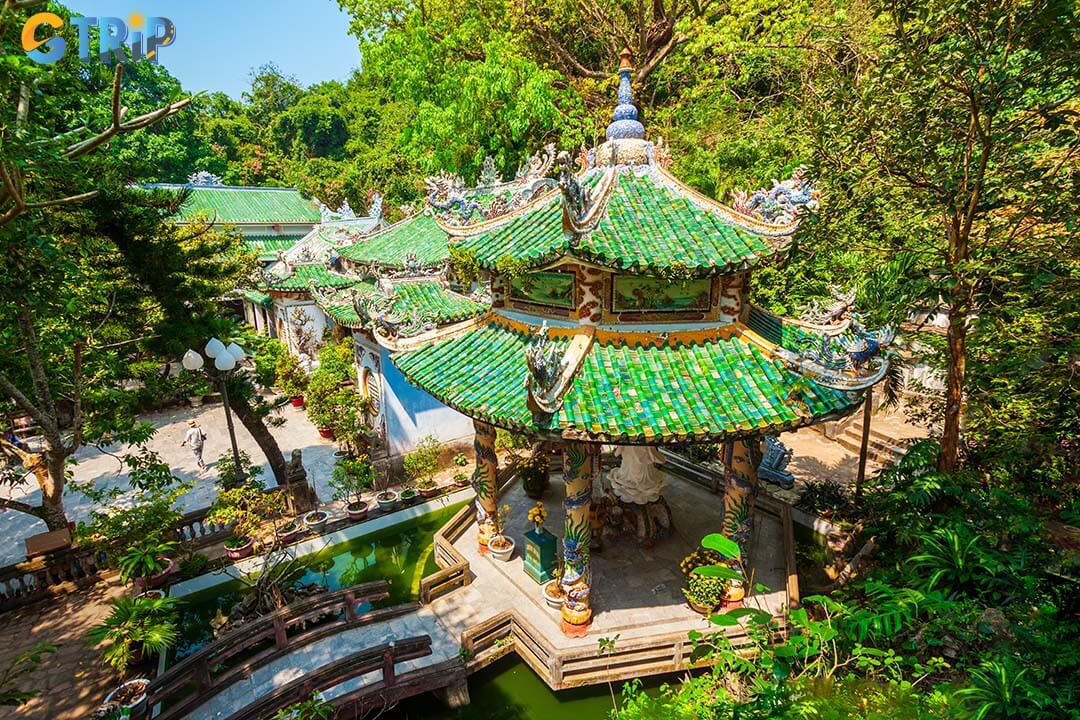 The pagoda’s artistic beauty shines through its dragon-adorned roofs, ancient stone stele, and timeworn carvings that reflect centuries of history and craftsmanship