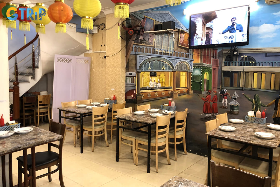 The restaurant's modest exterior belies an interior rich with aromatic spices and warm hospitality
