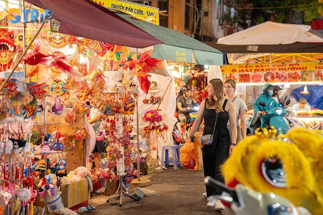 The street is illuminated by thousands of lanterns in every conceivable shape and color in the mid-autumn festival