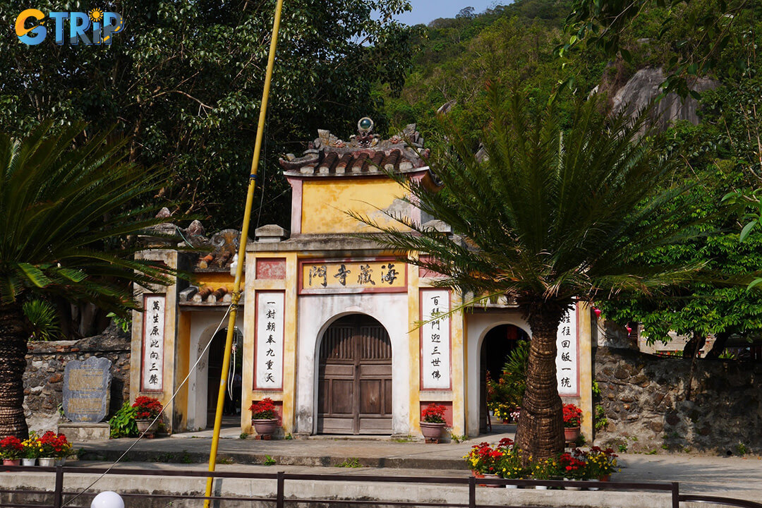 The Tam Quan Gate impresses with its ancient design, lotus-carved pillars, and yin-yang tiled roof, creating a serene and timeless entrance