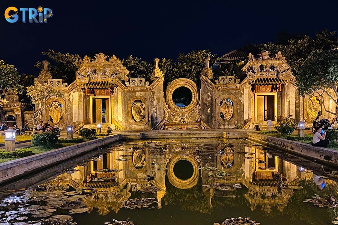 The temple becomes magical at night under the warm golden lights