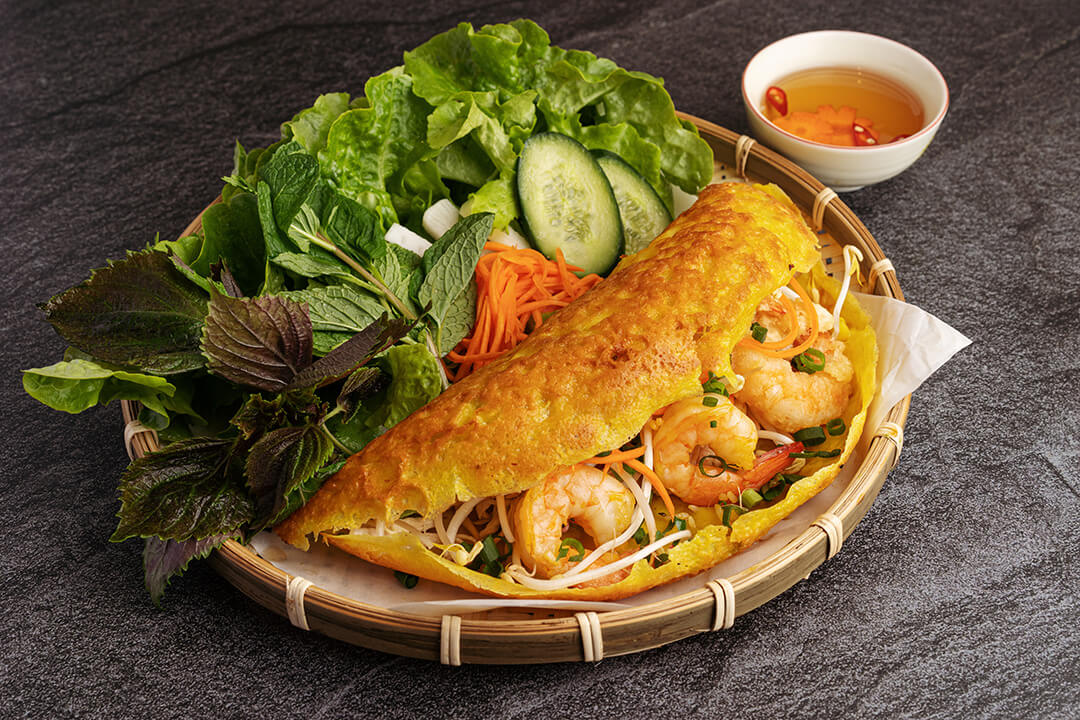 Banh Xeo (Vietnamese Sizzling Crepes): History, Ingredients, Places & How to Eat?