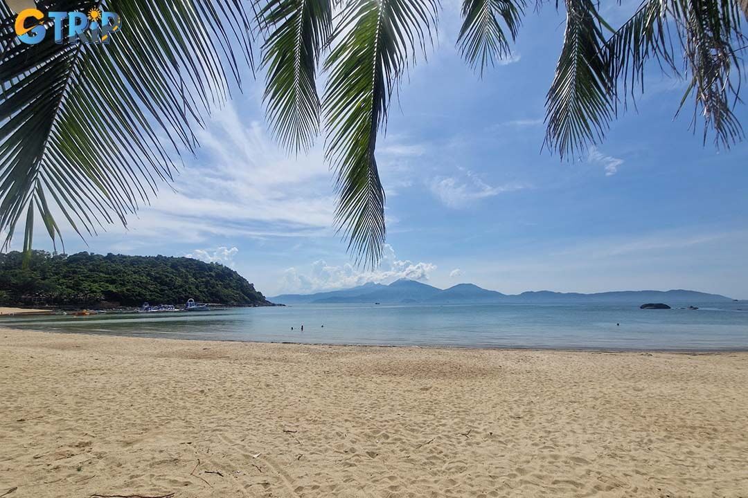 Tien Sa Beach is a serene, crescent-shaped bay nestled against the lush Son Tra Mountains, offering calm, clear waters and golden sands in a peaceful
