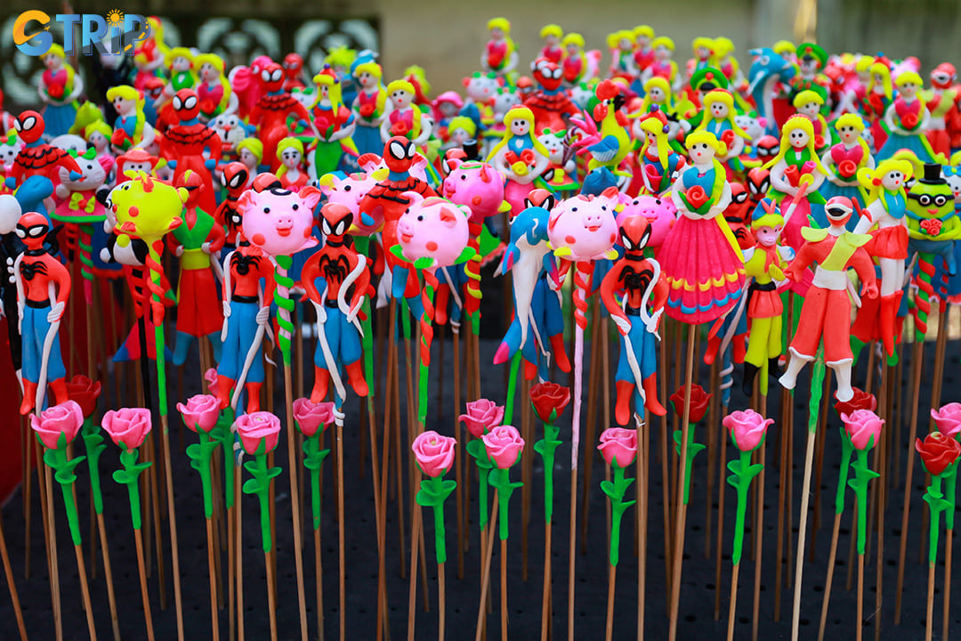 To he, Hanoi’s colorful rice dough figurines are whimsical folk art creations that capture Vietnamese childhood nostalgia and make uniquely charming cultural souvenirs