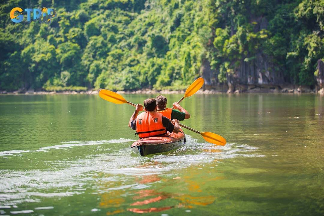 Tourists are paddling a kayak on the Ha Long