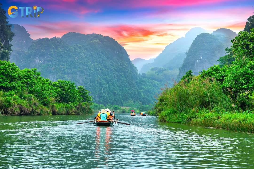 Tourists glide along calm rivers, marveling at the unspoiled beauty of Ninh Binh’s natural wonders