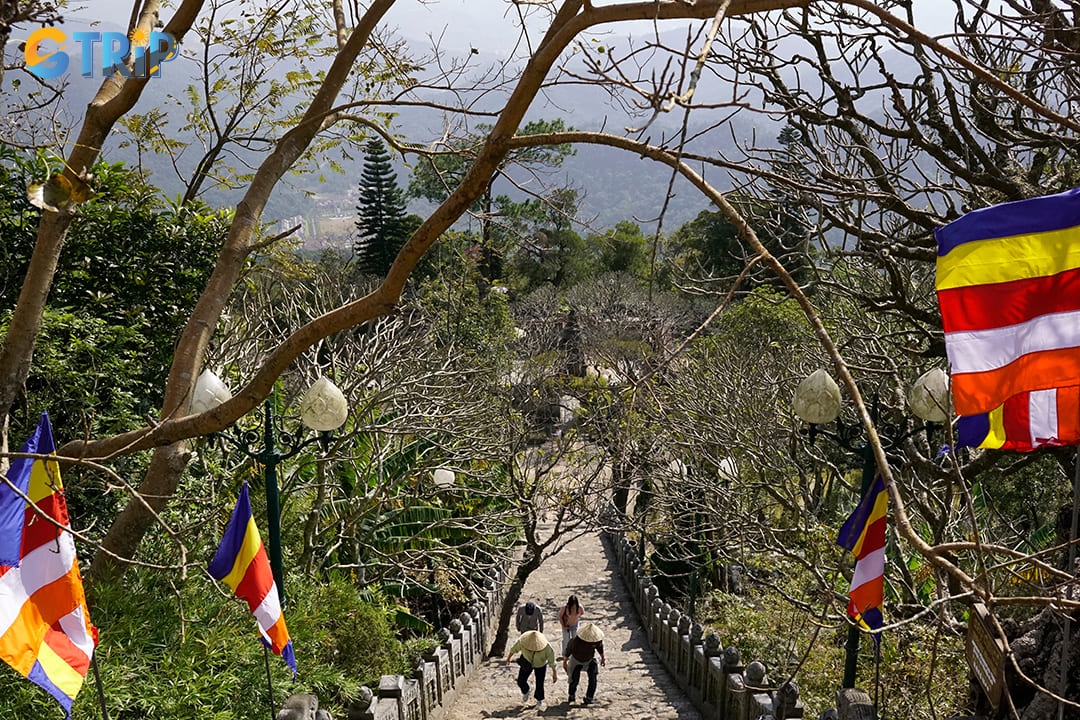 Tourists hiking up to the mountain by stairs