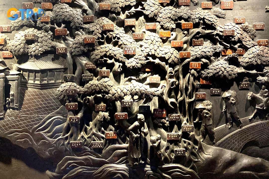 “Tree of Vietnamese Traditional Medicine” is an intricate wooden carving that honors 100 renowned physicians in Vietnamese history
