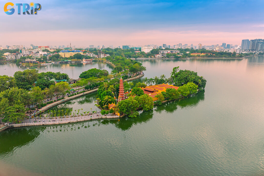 Unwind on a rooftop terrace with sweeping views of West Lake, craft cocktails, and Hanoi’s skyline glowing under the night sky