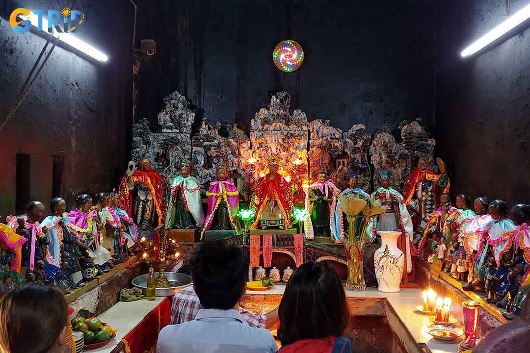 Visitors pray for children by offering incense, tying a red string to a Midwife statue, and gently touching its belly for fertility blessings
