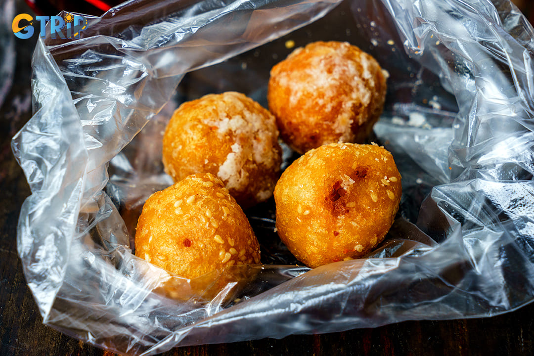 Vong Thi Savory Fried Cakes offers a slightly more refined take on this beloved Hanoi street food