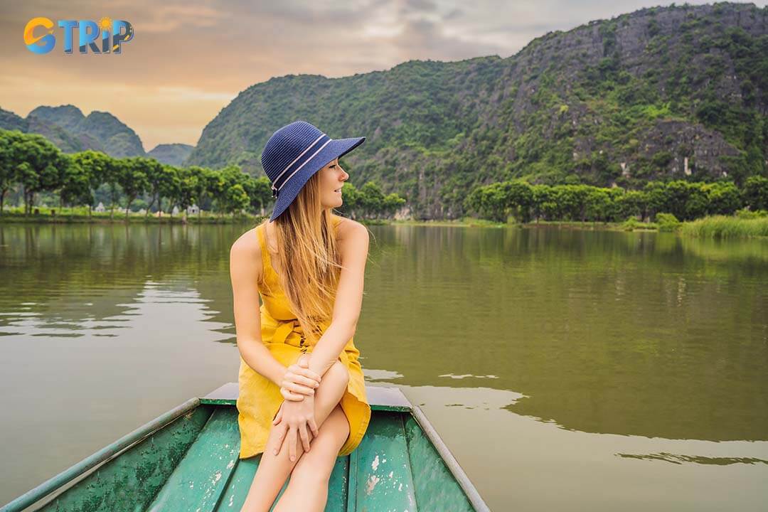 Tourist in boat on the lake in Tam Coc