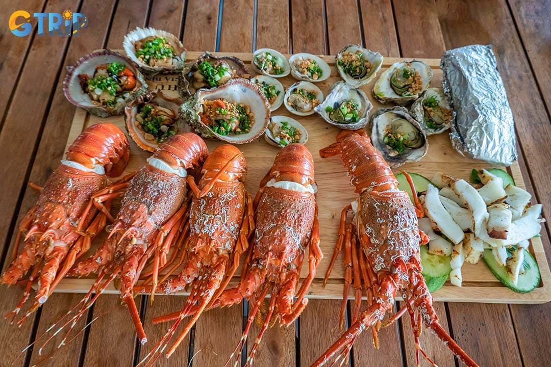 You should not miss fresh and delicious local seafood at Bai Huong Village