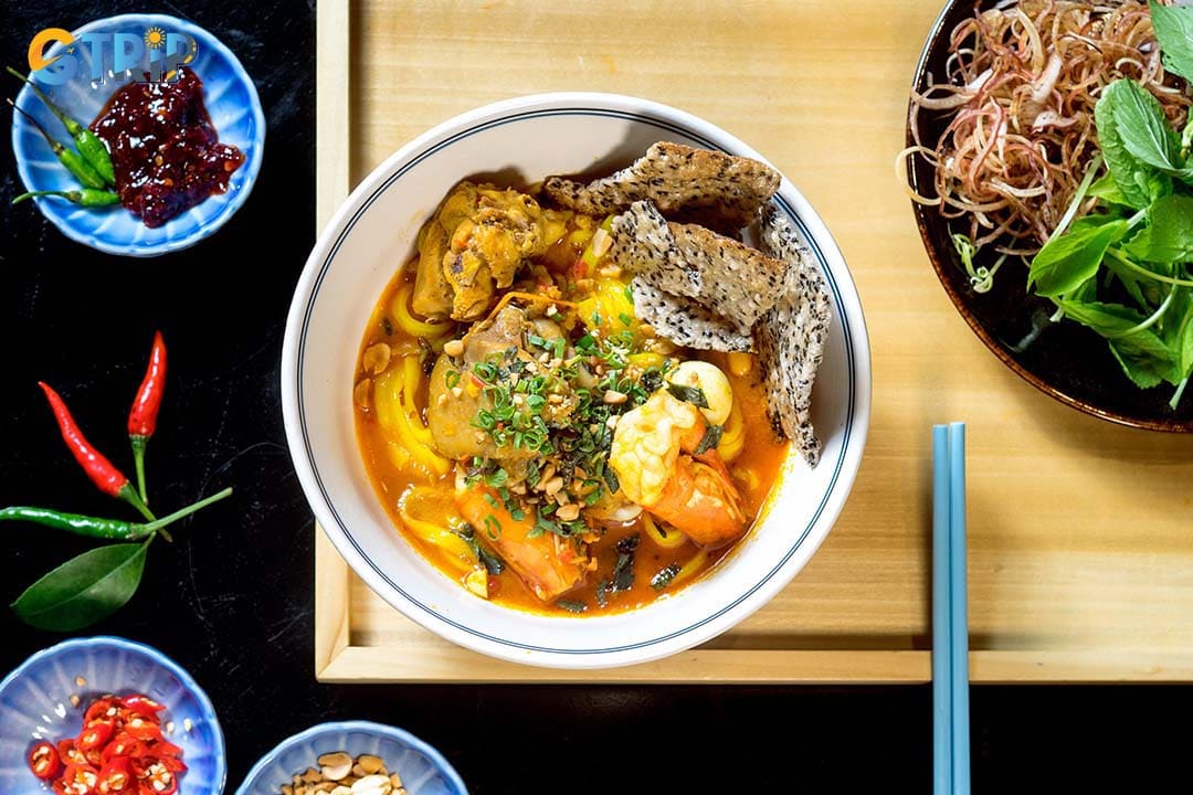 You should try Mi Quang (turmeric noodles with pork and shrimp) when visiting the area around the Han River Bridge