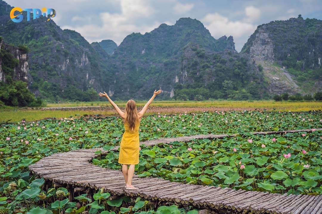 Tourist enjoying and breathing fresh air at the lotus lake